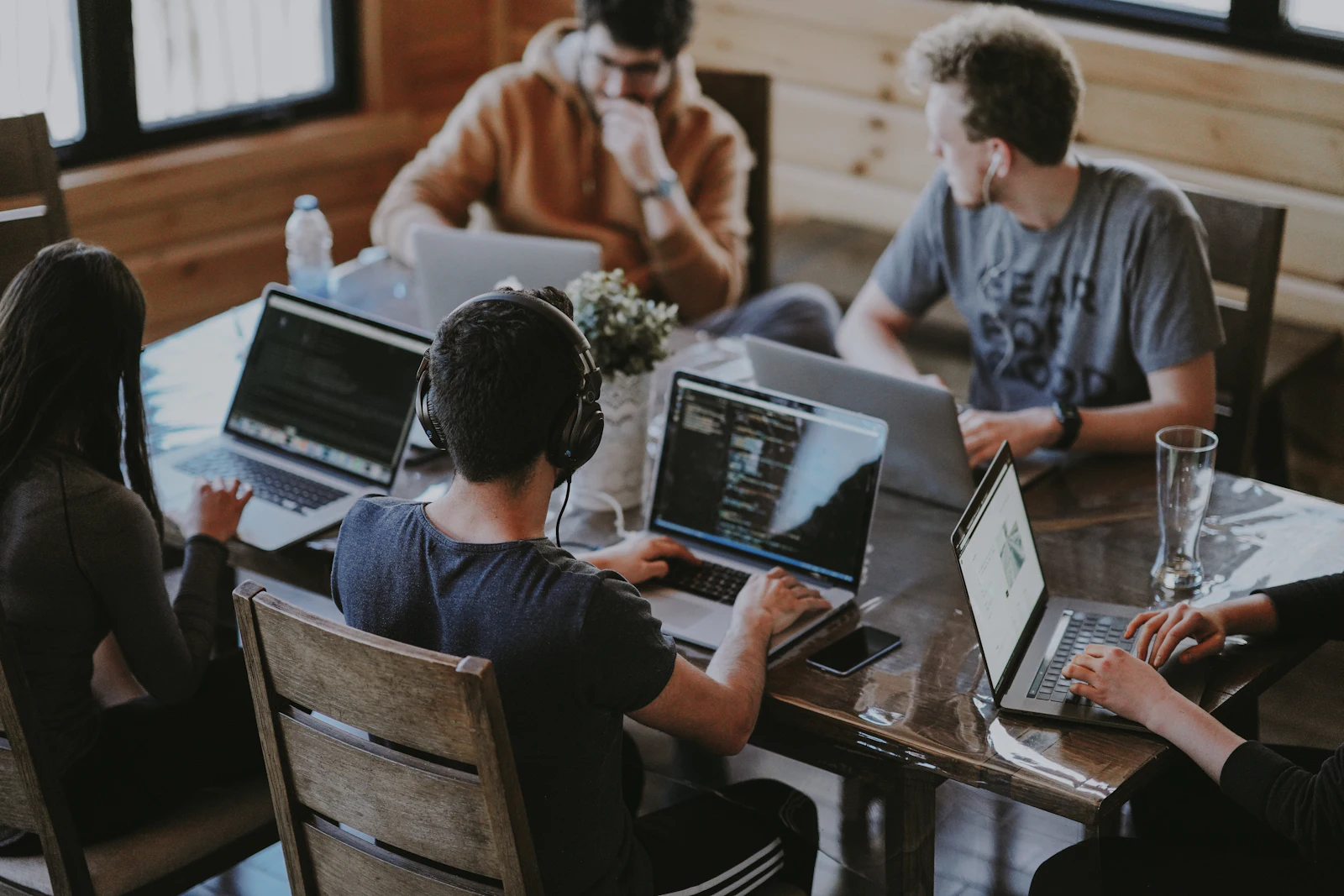 A team working together at a laptop